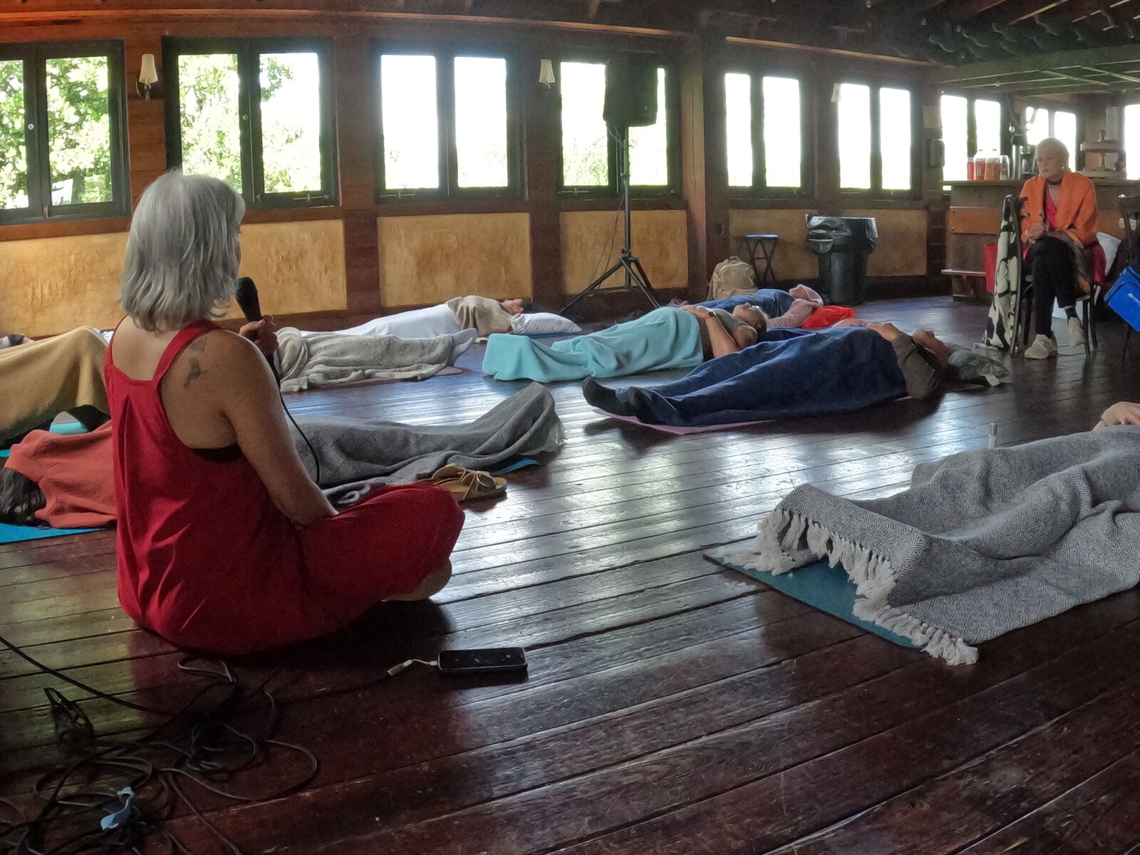 Participants in a guided meditation session during the somatic healing retreat